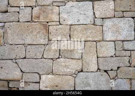 Natural background from an old stone wall Stock Photo