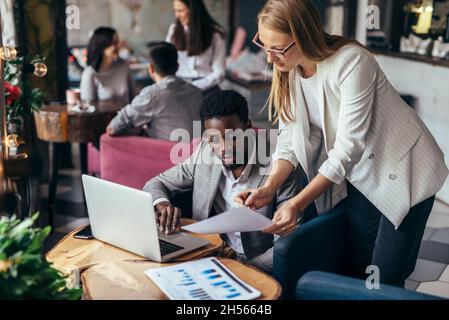 Two Businesspeople Having Informal Meeting In Coffee Shop. Stock Photo