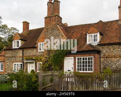 Listed flint built cottages with red tiled roofs in picturesque village of Hambleden Buckinghamshire England UK village in Chiltern Hills Stock Photo