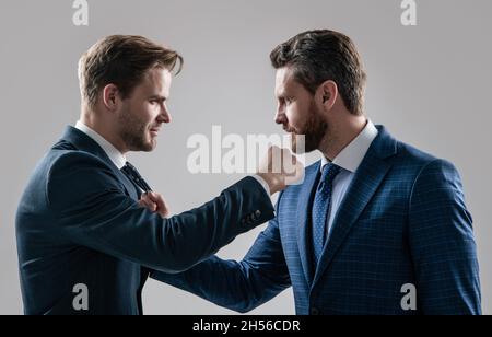 disagreed men business partners disputing aggressive and angry while conflict, discuss failure. Stock Photo