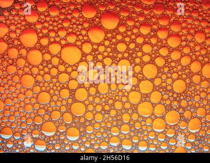 Orange bubbles background. Foam bubbles macro texture. Stock Photo
