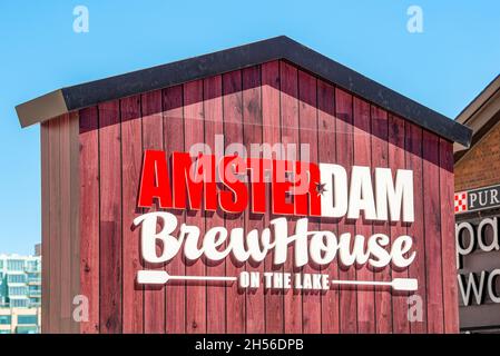 Entrance sign of the Amsterdam Brewhouse restaurant in the waterfront of Toronto city in Canada.Nov. 6, 2021 Stock Photo