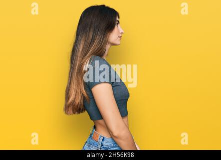 Young Beautiful Girl Isolated Background Looking Side Relax Profile Pose  Stock Photo by ©Krakenimages.com 246821028