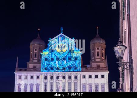 AUGSBURG, GERMANY - OCTOBER 24: Illuminated historic buildings at the festival of lights in Augsburg, Germany on October 24, 2021 Stock Photo