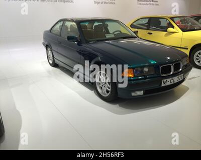 BMW 3 Series (E36): Side view, 3rd generation green, manufactured from 1990 to 1998. BMW Museum, Munich - Germany - September 2013. Stock Photo