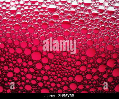 Red bubbles background. Foam bubbles macro texture. Stock Photo