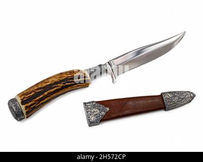 Horn hunting knife with protective cover isolated on white background Stock Photo