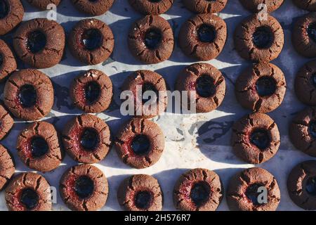 High angle view on baking tray with one missing homemade cocoa cookie. Stock Photo