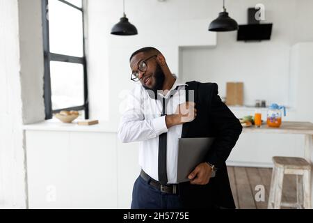 African American man talking on mobile phone in a hurry Stock Photo