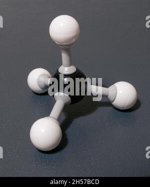 Model of methane (CH4) molecule, responsible for heating of the atmosphere and climate change. Model used in chemistry class. Stock Photo