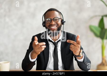 African American man in headset talking to camera Stock Photo