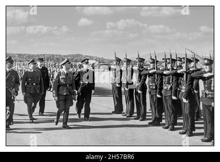 HIMMLER NORWAY Friday 23 May 1941, Heinrich Himmler arrived on Wednesday 21 May: «The first branch of the new Norwegian SS taken under oath. Reichsführer SS Heinrich Himmler speaks to the SS people. For the second time, the Reichsführer has SS. and Chief of the German Police, Heinrich Himmler, visited Norway at the invitation of Reichskommissar Terboven. Wednesday afternoon came Reichsführer SS. to Fornebo, where he was received by a number of guests of honor with Reichskommissar Terboven, Colonel-General von Falkenhorst and Nasjonal Samling's leader Vidkun Quisling at the helm. Stock Photo