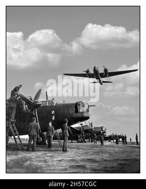 WW2 RAF Wellington Bombers with ground crews working and preparing a turnaround on their Vickers Wellington bombers, as a Wellington Bomber takes off and flies overhead. RAF Hemswell Lincolnshire, UK 1943 World War II Britain UK Royal Airforce Stock Photo