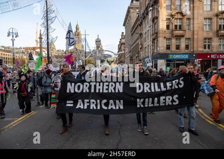 Glasgow, Scotland, UK. 7th November  2021: Climate change campaigners march along St Vincent Place to promote climate justice on day eight of the UN climate change conference COP26. Credit: Skully/Alamy Live News Stock Photo