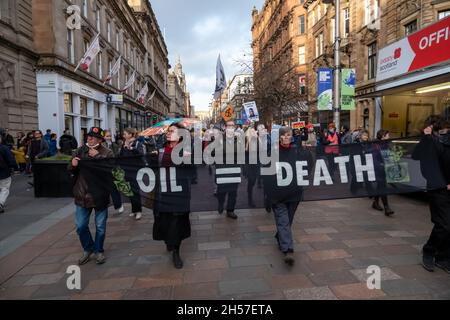 Glasgow, Scotland, UK. 7th November  2021: Climate change campaigners march along Buchanan Street to promote climate justice on day eight of the UN climate change conference COP26. Credit: Skully/Alamy Live News Stock Photo
