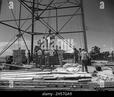 The world's first atomic weapon being readies at the base of the tower at the Trinity test site Stock Photo