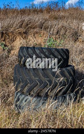 old rubber tires stacked on top of each other Stock Photo