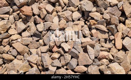 granite large crushed stone top view. background of stones Stock Photo