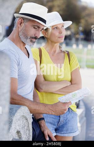 senior tourist couple after an argument Stock Photo