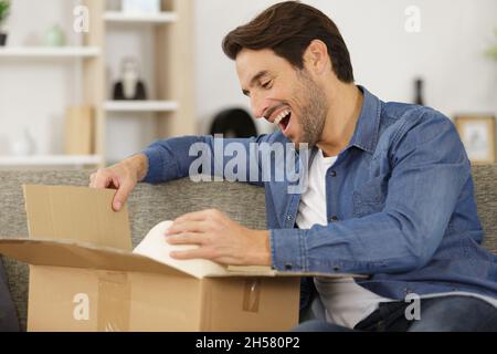 happy man opening a present Stock Photo