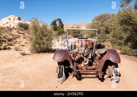 Old antique car wrecks from the old gold rush time in Joshua Tree National Park, USA Stock Photo