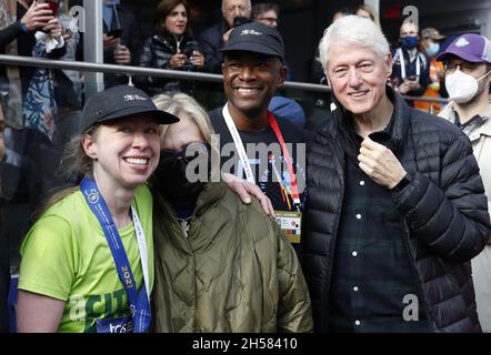New York, United States. 07th Nov, 2021. After crossing the finish line Chelsea Clinton poses for a picture with parents Hillary and Bill Clinton along with marathon director Ted Metellus at the NYRR TCS New York City Marathon in New York City on Sunday, November 7, 2021. Over 50,000 runners from New York City and around the world race through the five boroughs on a course that winds its way from the Verrazano Bridge before crossing the finish line by Tavern on the Green in Central Park. Photo by John Angelillo/UPI Credit: UPI/Alamy Live News Stock Photo