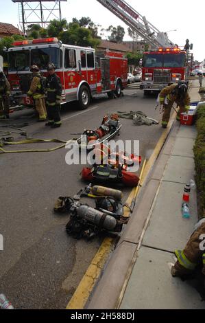 Support equipment ready for use by San Diego City  Fire Fighters at a structure fire on University Avenue in San Diego, California. Stock Photo