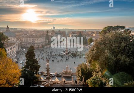 Piazza del Popolo in the evening, with the Vatican Dome in the background. Photo taken from Terrazza del Pincio. Scenic sunset in Rome, Italy. Stock Photo