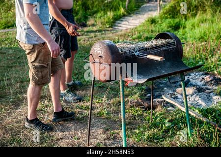 grilled meat skewers chicken the meat holder over fire burned churcoal Stock Photo