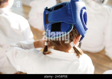 Karate students train in the martial arts hall. Martial arts school training in the gym Stock Photo