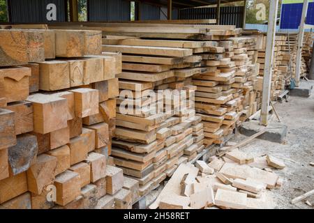 Sale of pine boards intended for construction. Warehouse wood bars boards Stock Photo