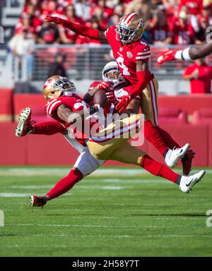 Santa Clara, CA, USA. 26th Sep, 2021. Green Bay Packers' AJ Dillon (28) is  tackled by San Francisco 49ers' Azeez Al-Shaair (51) and San Francisco 49ers'  Emmanuel Moseley (4) after a pass