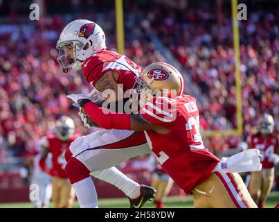 San Francisco 49ers' Talanoa Hufanga and Dontae Johnson break up a