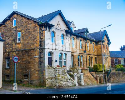 These houses are on Osbourne Terrace on Church Street in Padiham. One used to be a doctors surgery with an entrance at ground level now bricked up Stock Photo
