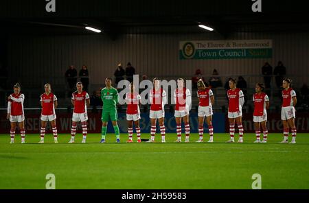 BOREHAMWOOD, ENGLAND - NOVEMBER 07 : Arsenal team stand for a moments silence to commemorate remembrance day L-RKim Little of Arsenal, Beth Mead of Arsenal Noelle Maritz of Arsenal, Manuela Zinsberger of Arsenal, Nikka Parris of Arsenal, Lotte Wubben-Moy of Arsenal Frida Maanum of Arsenal Leah Williamson of Arsenal Caitlin Foord of Arsenal Mana Iwabuchi of Arsenal and Katie McCabe of Arsenal during Barclays FA Women's Super League between Arsenal Women and West Ham United Women at Meadow Park, Borehamwood, UK on 07th November 2021 Stock Photo