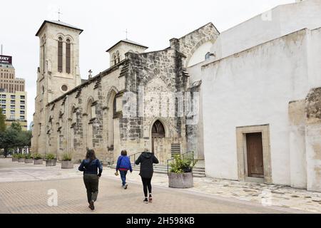 People walking by San Fernando Cathedral in San Antonio, Texas. Stock Photo