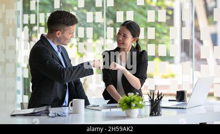 Business teamwork concept. Businessman and businesswoman happy with the works and encourage together Stock Photo