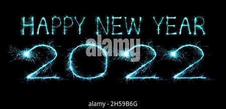 2022 happy new year fireworks written sparkling sparklers at night Stock Photo