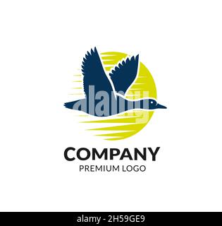 duck flying logo vector with yellow circle background Stock Vector