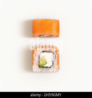 Flat lay of two Philadelphia rolls isolated on white. Top view of sushi with salmon and cream cheese Stock Photo