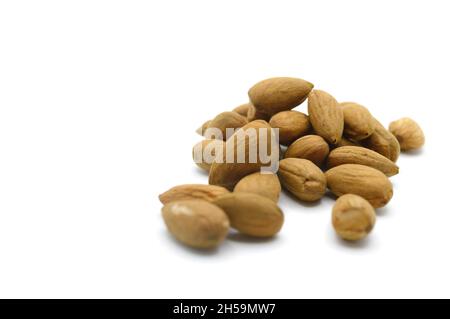 Raw organic healthy almonds on horizontal white backdrop Stock Photo