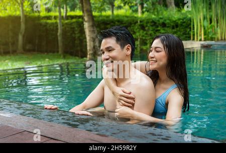 young couple having fun in swimming pool Stock Photo