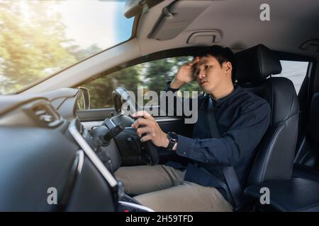 stressed man driver sitting inside a car Stock Photo