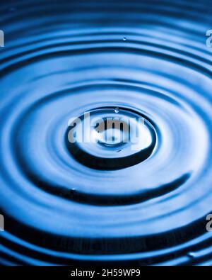 Splashes of water and blurry waves on it. Stock Photo