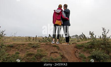 Young couple viewing Tantallon castle from a distance Stock Photo