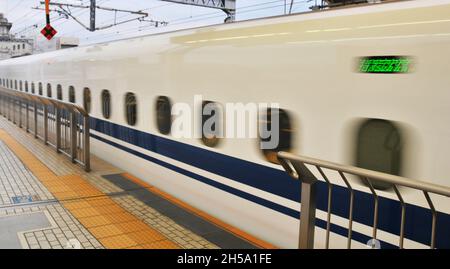 Shinkansen bullet train entering in Kyoto railway station, Japan