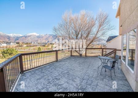 Mountain range view from the veranda of a two-storey house Stock Photo