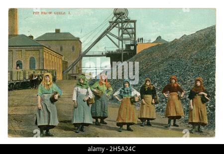 Original early 1900's postcard of pit brow girls wearing headscarves, working clothes, at the pit head, Wigan Junction Colliery, Lancashire, England, U.K.  posted in 1911 but image from circa 1905. Stock Photo