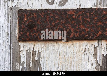 Rusty door hinges on an old garage in the UK Stock Photo