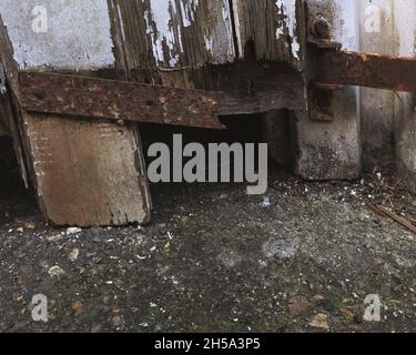 Rusty door hinges on an old garage in the UK Stock Photo